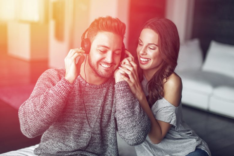 Young Couple Listening To Music