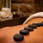 What are the benefits of Warm stone massage?