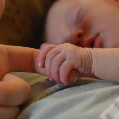 baby-holding-human-finger