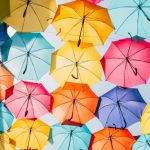 Which color of an umbrella is more effective against sunlight?