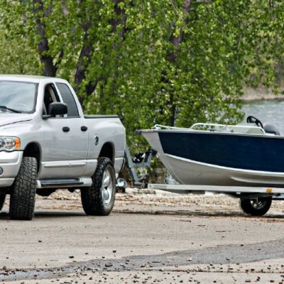 truck-towing-boat-next-to-lake-shore