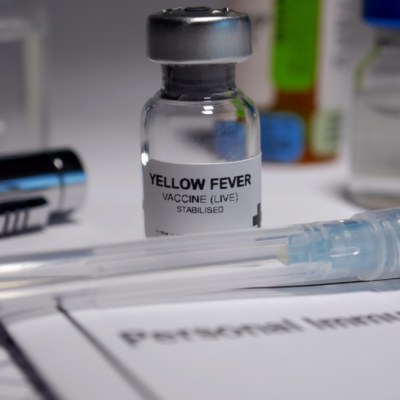 yellow-fever-vaccine-vial-and-syringe-on-a-personal-immunization-form-for-travel-preparation