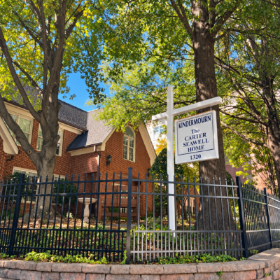 KinderMourn’s Carter Seawell Home in Charlotte, with its sign framed by trees.